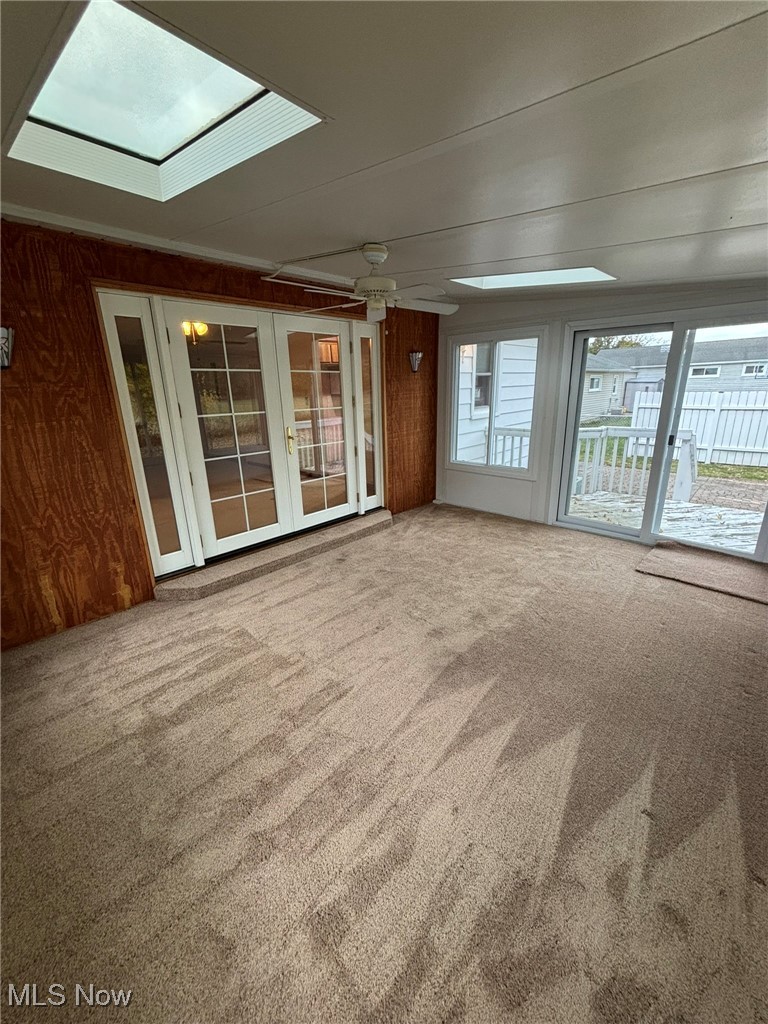 1039 Center Road Eastlake, OH 44095 - Photo 9 of 29 Sun room featuring French doors leading into the living room and a wealth of natural light