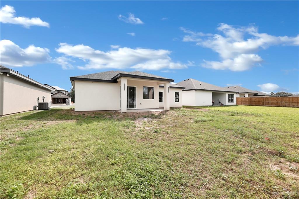 425 South 12th Street Alamo, TX 78516 - Photo 14 of 15 a house view with a garden space