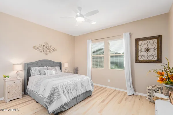 a bedroom with a large bed and a window