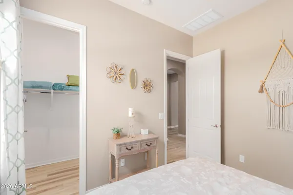 a bedroom with a bed and a view of bathroom