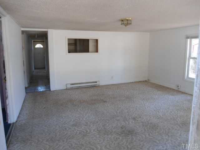 1501 Axum Road Garner, NC 27529 - Photo 2 of 10 an empty room with windows