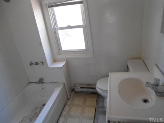 1501 Axum Road Garner, NC 27529 - Photo 4 of 10 a bathroom with a sink a toilet and bathtub