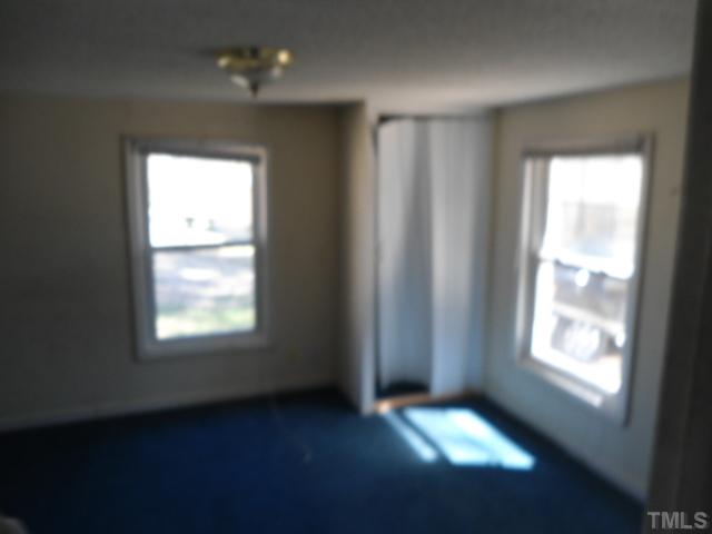 1501 Axum Road Garner, NC 27529 - Photo 5 of 10 a view of an empty room with a window