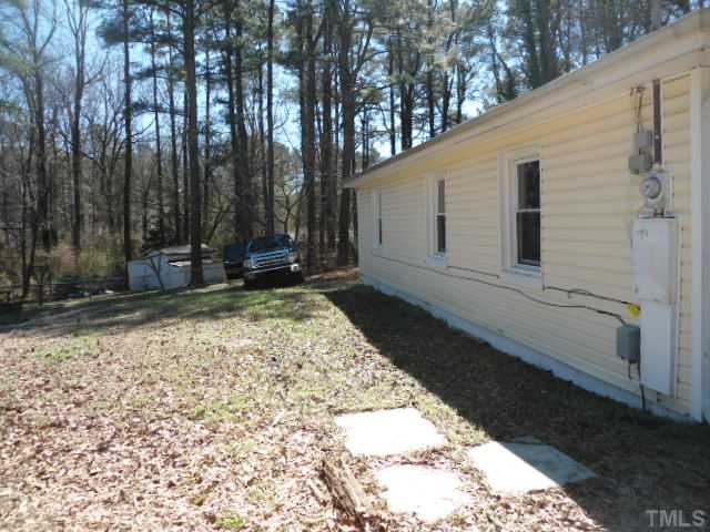 1501 Axum Road Garner, NC 27529 - Photo 10 of 10 a backyard of a house with a large tree