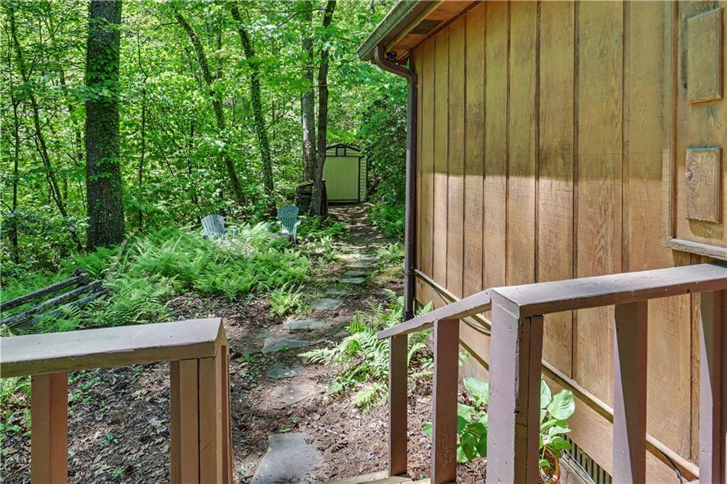 102 Moses Road Rabun Gap, GA 30568 - Photo 33 of 40 a view of a house with backyard and trees