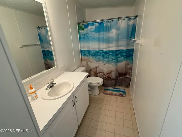 a view of balcony with wooden floor and fence