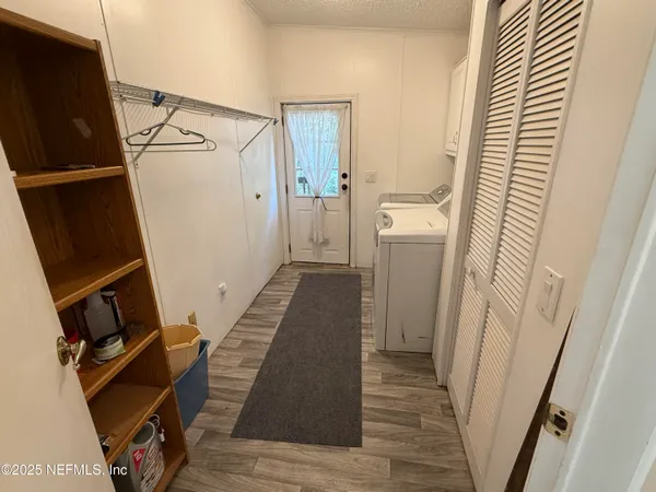 a view of deck with patio and wooden fence