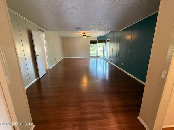 a view of gallery with wooden floor