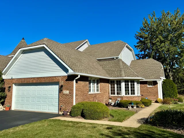 a house that has yard in front of it