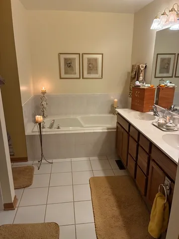 a bathroom with a tub sink and toilet