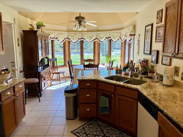a kitchen with sink cabinets and outdoor view
