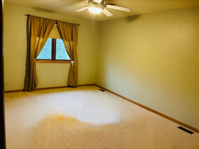 a kitchen with a table and chairs