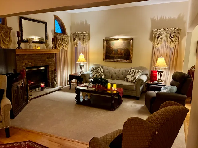 a living room with furniture and a fireplace