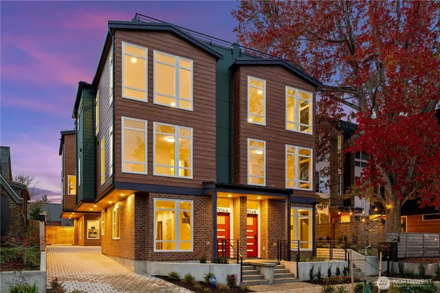 front view of a brick house with a large windows