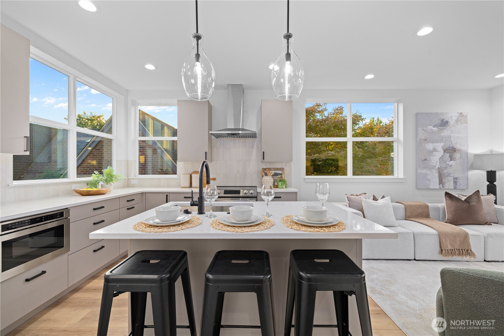 1704 North 47th Street Seattle, WA 98103 - Photo 13 of 38 a kitchen with granite countertop a sink cabinets and window