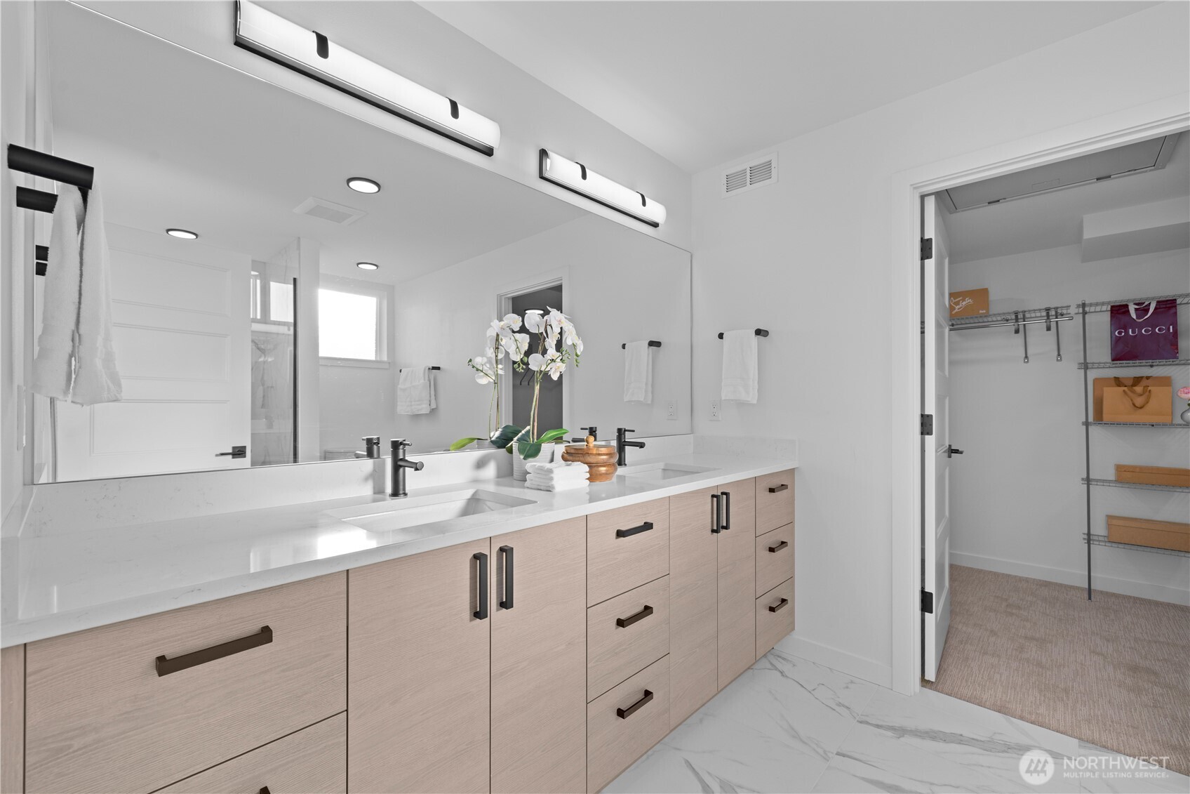 1704 North 47th Street Seattle, WA 98103 - Photo 21 of 38 a bathroom with double sink and a mirror