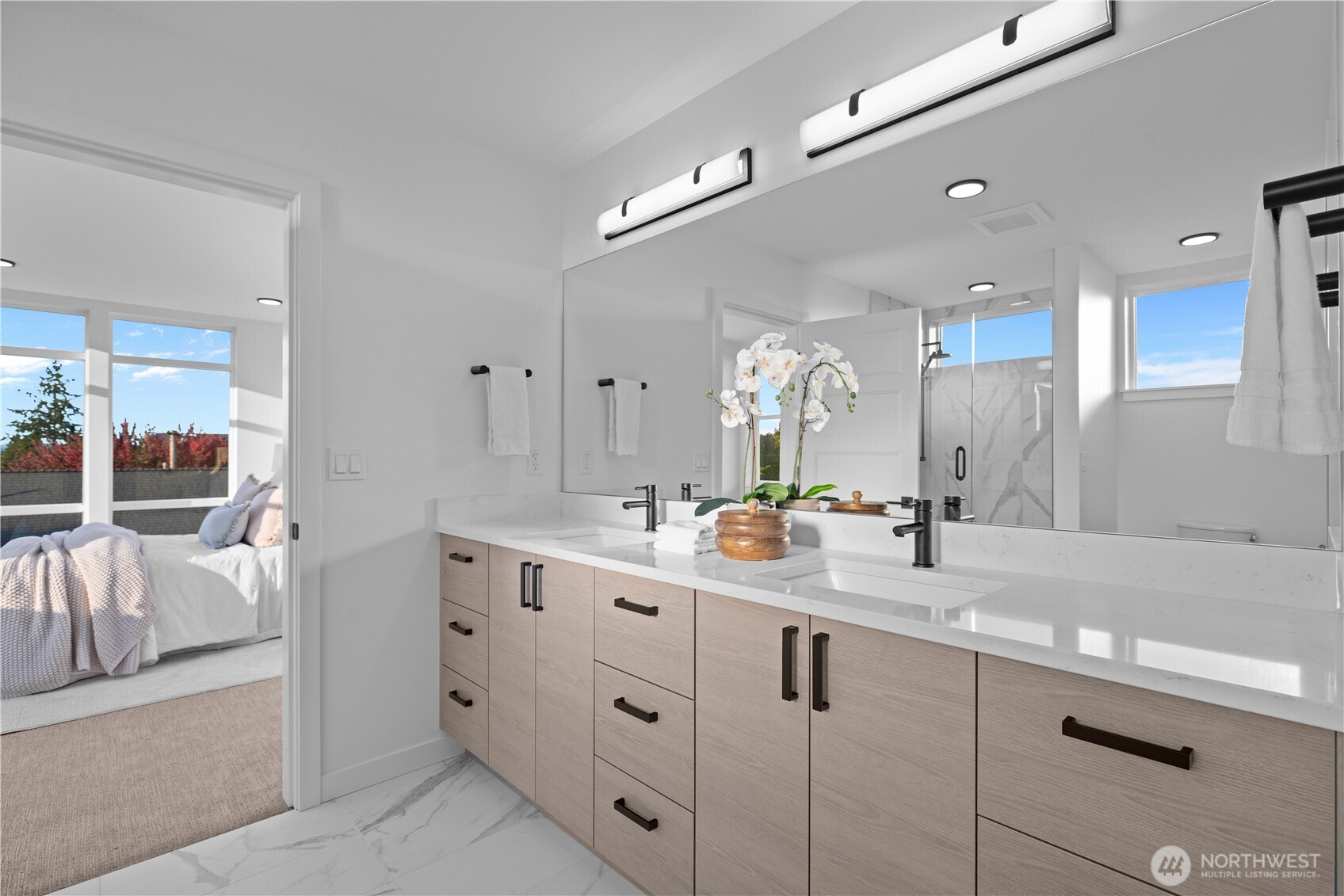 1704 North 47th Street Seattle, WA 98103 - Photo 22 of 38 a bathroom with double sink and a mirror