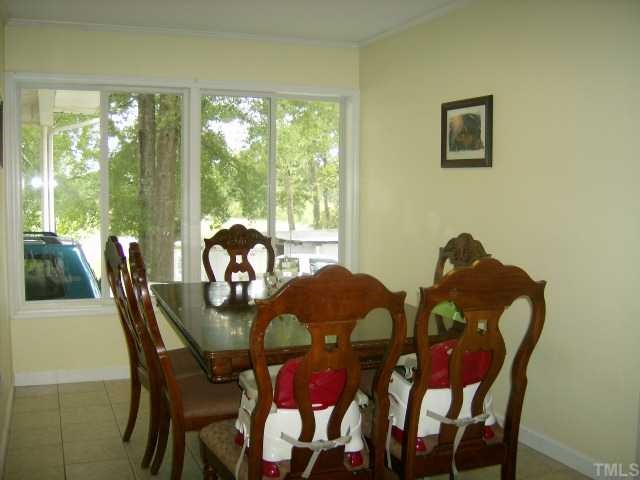 375 Chambers Loop Road Timberlake, NC 27583 - Photo 4 of 12 THE DINING ROOM HAS TILE FLOOR AND NICE COUNTRY VIEW