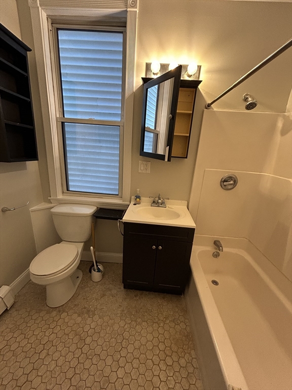 279 Webster Street, Unit 2 Boston, MA 02128 - Photo 11 of 20 a spacious bathroom with a bathtub sink and toilet