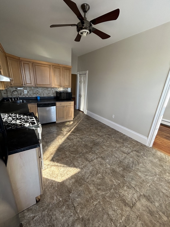 279 Webster Street, Unit 2 Boston, MA 02128 - Photo 14 of 20 a kitchen with stainless steel appliances granite countertop a stove a sink and a refrigerator