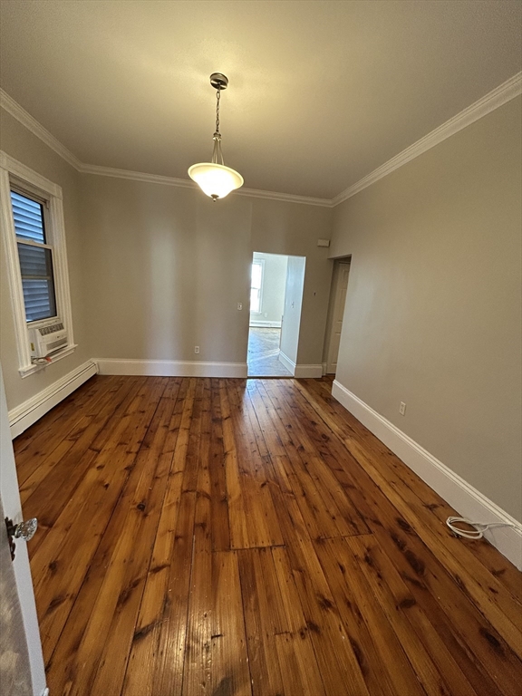 279 Webster Street, Unit 2 Boston, MA 02128 - Photo 9 of 20 a view of empty room with wooden floor