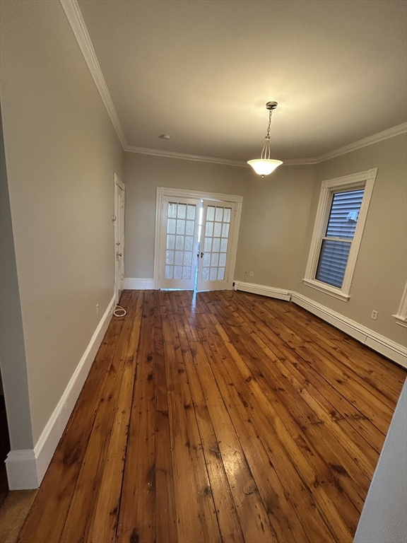 279 Webster Street, Unit 2 Boston, MA 02128 - Photo 10 of 20 a view of a room with wooden floor and a window