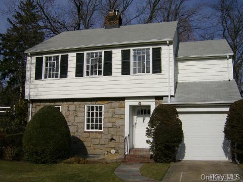 33 Shoreview Road Manhasset, NY 11030 - Photo 1 of 1 a front view of a house with a yard
