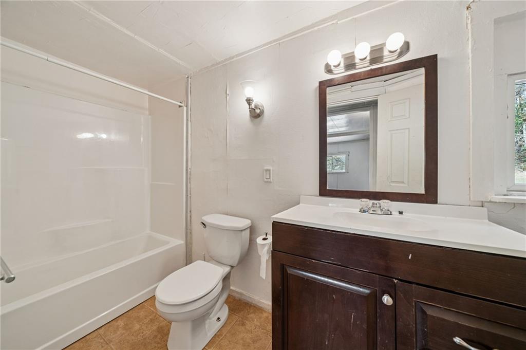 119 Story Road Export, PA 15632 - Photo 14 of 38 a bathroom with a sink a toilet and shower