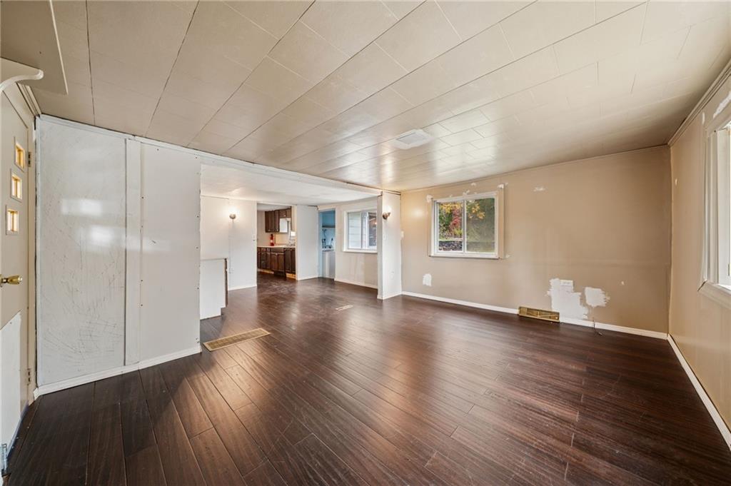 119 Story Road Export, PA 15632 - Photo 3 of 38 a view of a big room with wooden floor and windows