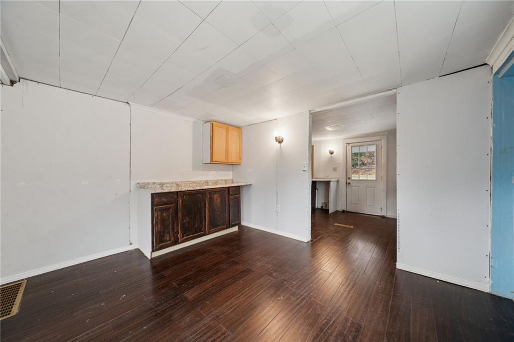 119 Story Road Export, PA 15632 - Photo 7 of 38 a view of an empty room with wooden floor fireplace and a window