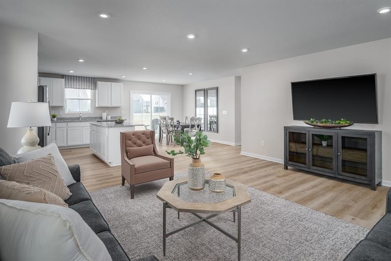 625 Merle Avenue Franklin, KY 42134 - Photo 8 of 15 a living room with furniture a flat screen tv and kitchen view