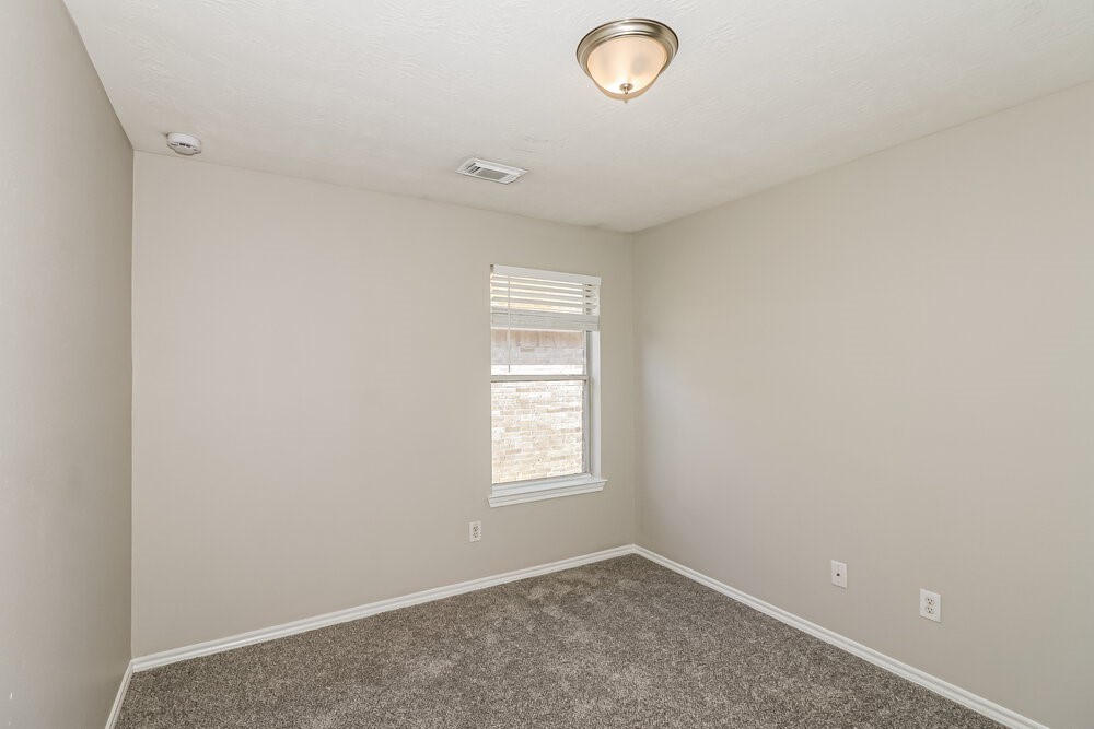16419 Great Ridge Court Houston, TX 77083 - Photo 12 of 16 an empty room with windows