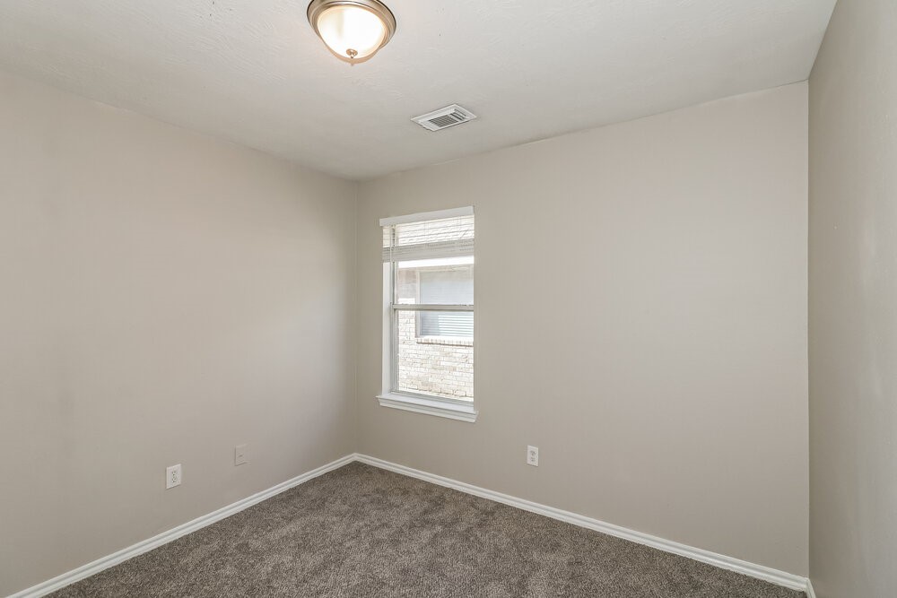 16419 Great Ridge Court Houston, TX 77083 - Photo 14 of 16 a view of an empty room with a window