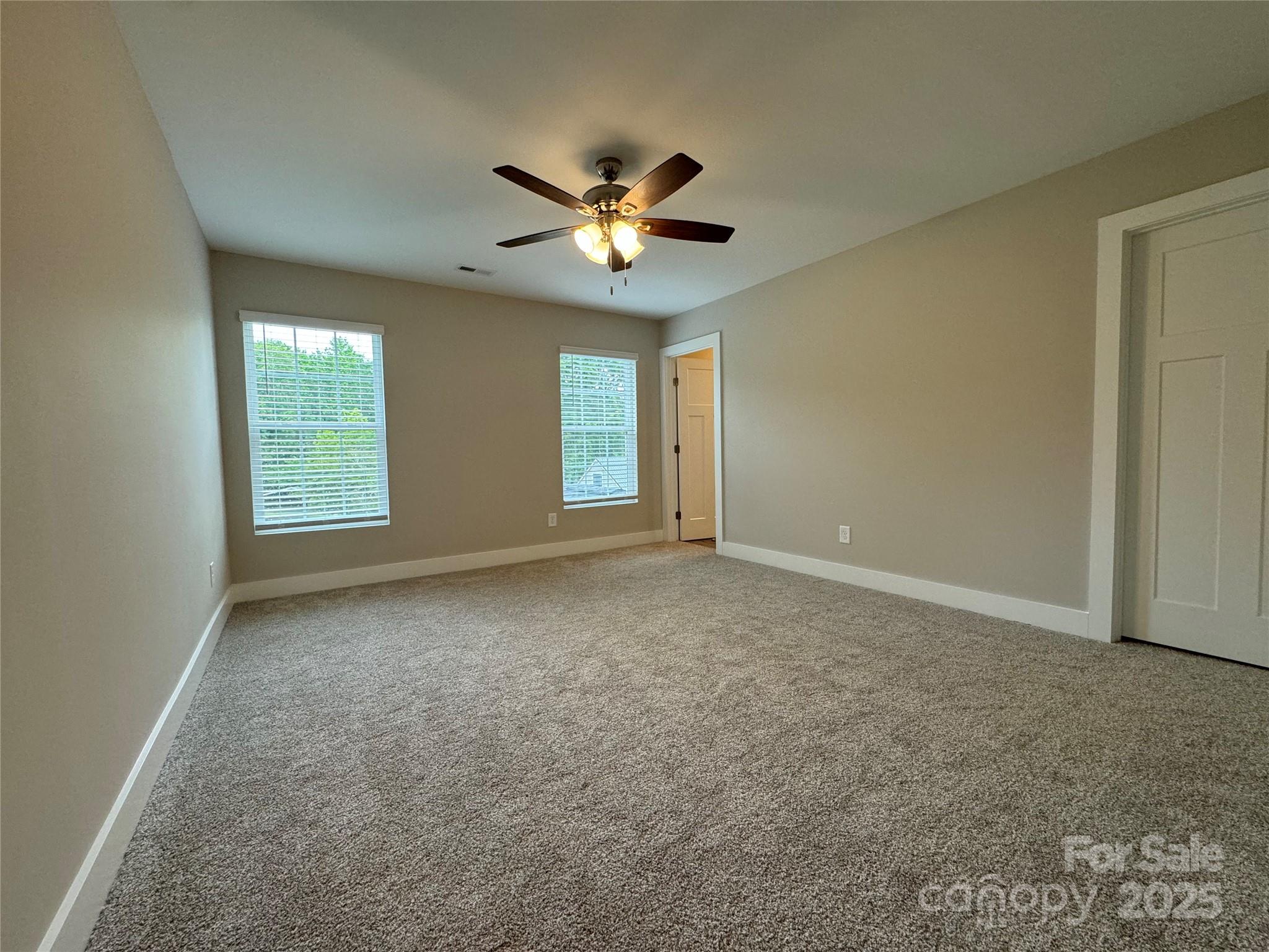 2012 Crown Point Drive Albemarle, NC 28001 - Photo 21 of 41 an empty room with windows and fan