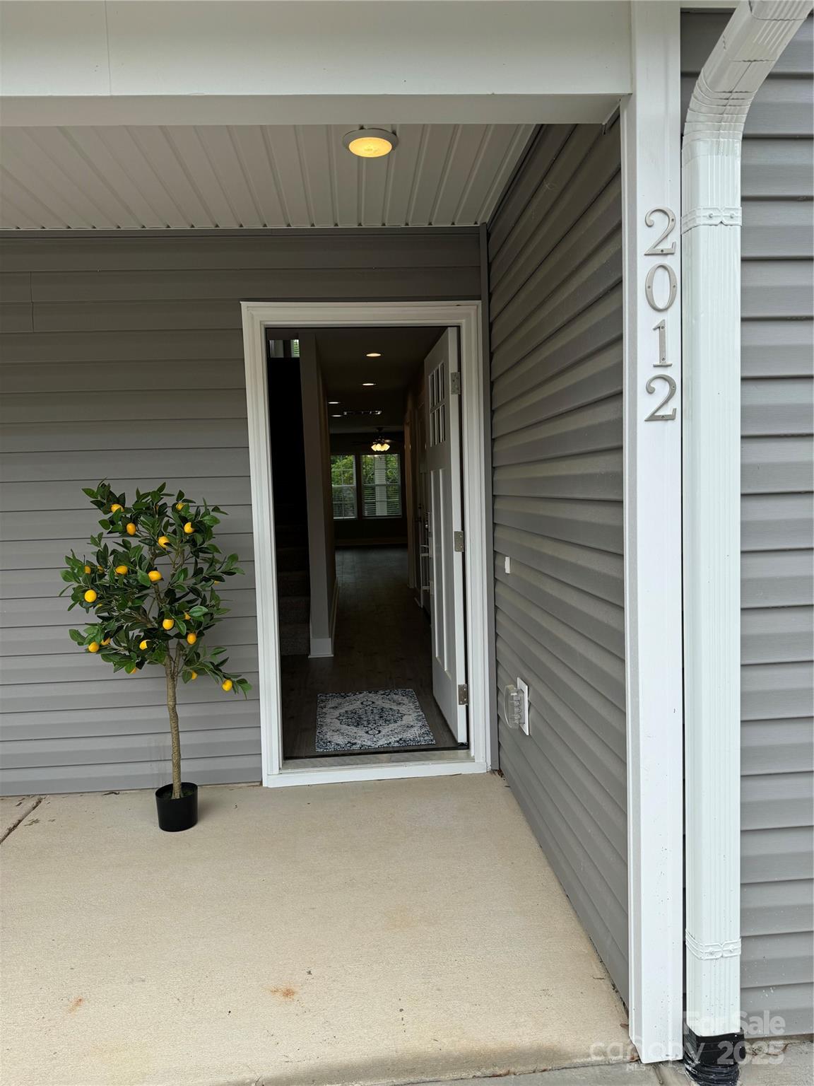 2012 Crown Point Drive Albemarle, NC 28001 - Photo 3 of 41 a view of backyard door with potted plants