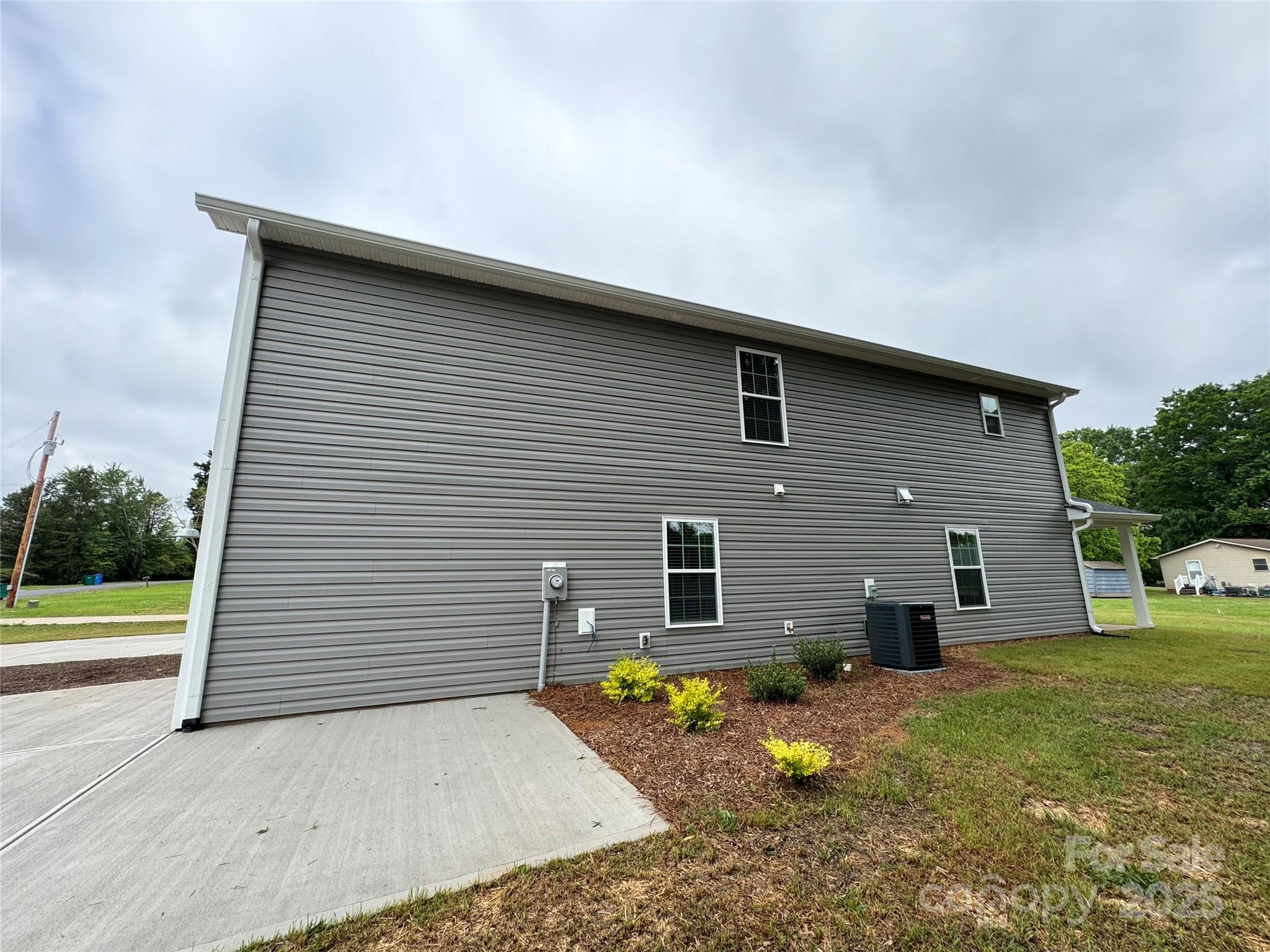 2012 Crown Point Drive Albemarle, NC 28001 - Photo 36 of 41 a backyard of a house with barbeque oven and brick wall