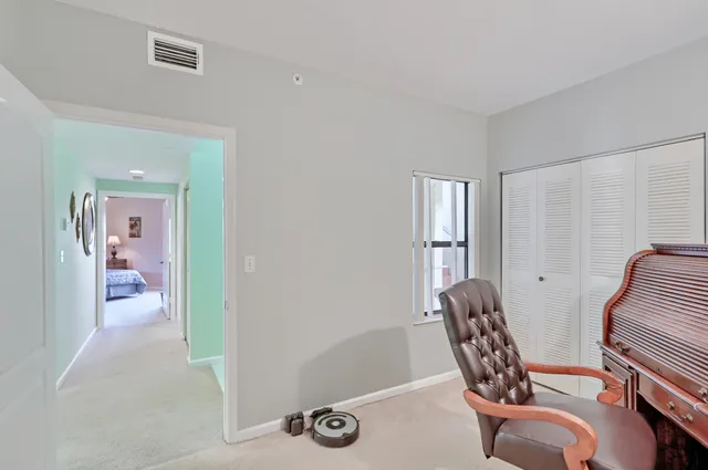 a workspace with furniture and a potted plant