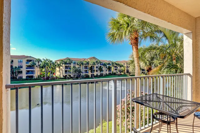a view of a balcony with wooden floor