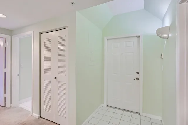 a view of a livingroom with furniture and a bicycle
