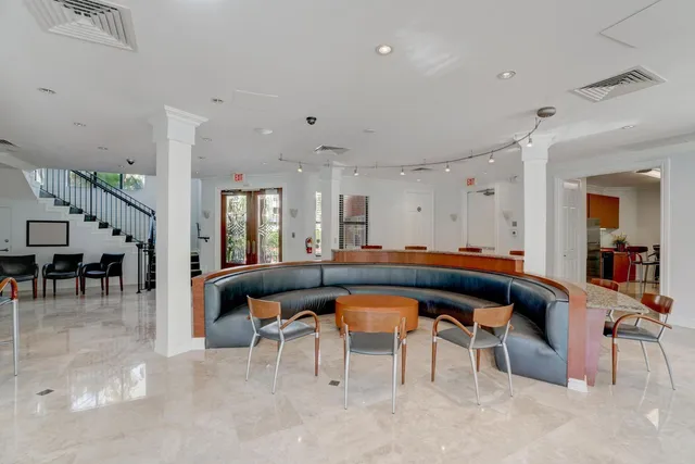 a view of a room with large windows