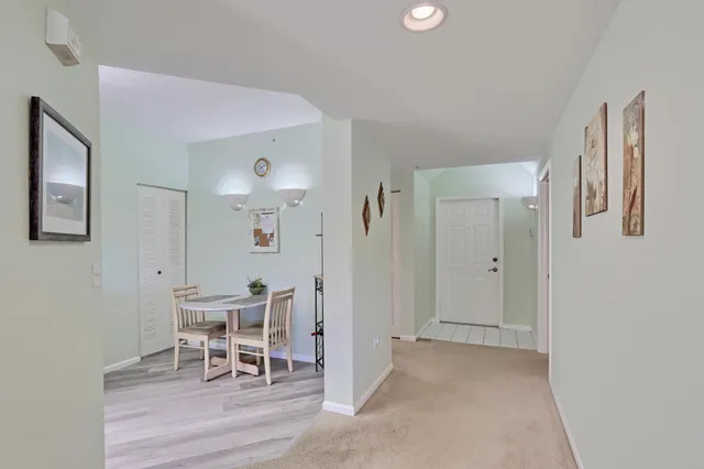 a kitchen with granite countertop a sink stove and cabinets