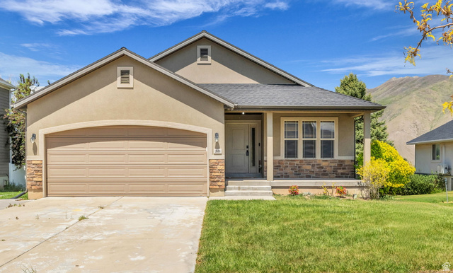 1836 West 800 North Mapleton, UT 84663 - Photo 2 of 38 Stucco exterior with stone accenting, covered front entry, and attached two-car garage