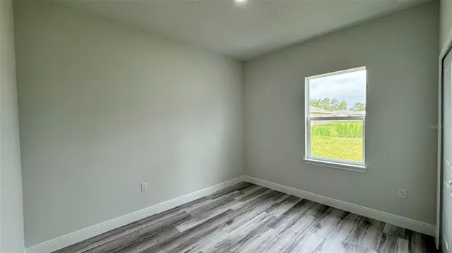 a view of an empty room and window