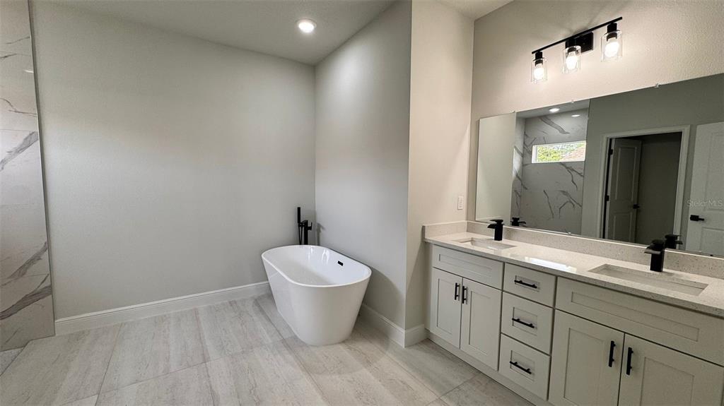 16884 Southwest 39th Circle Ocala, FL 34472 - Photo 23 of 29 a bathroom with a toilet sink and mirror