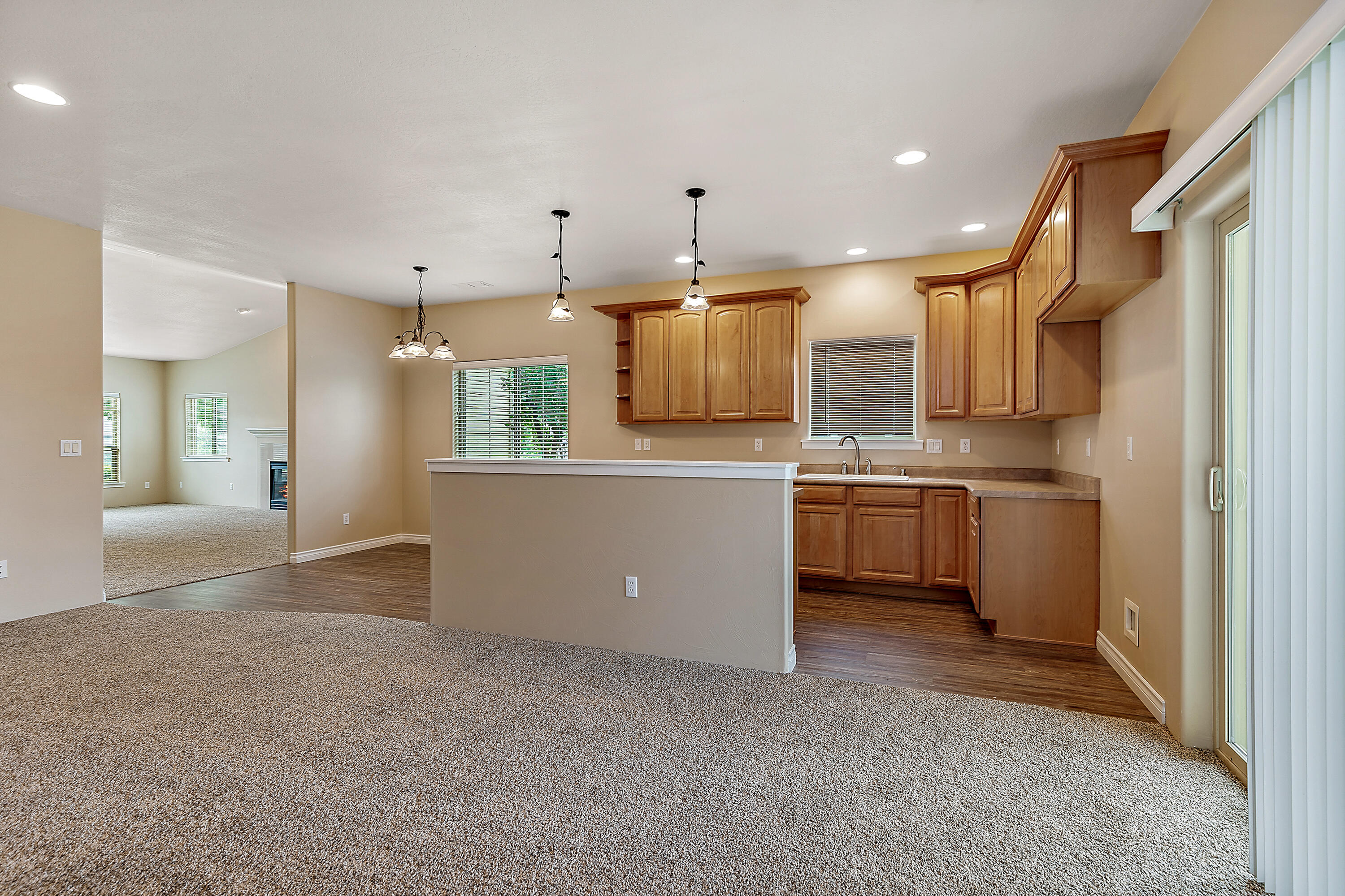 948 Win Way Eagle Point, OR 97524 - Photo 14 of 32 a kitchen with a sink stainless steel appliances and white cabinets