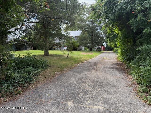 548 Hill Road Toms River, NJ 08753 - Photo 7 of 16 a view of a house with a yard