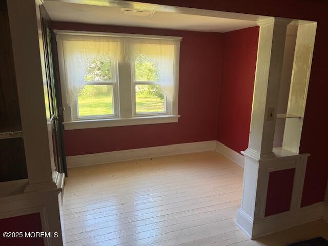 548 Hill Road Toms River, NJ 08753 - Photo 10 of 16 a view of an empty room with wooden floor and a window