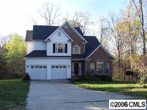 4516 Steepleton Way Charlotte, NC 28215 - Photo 1 of 3 a view of a big house with a big yard and large trees