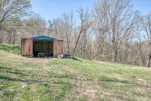 a view of a house with a yard and garage