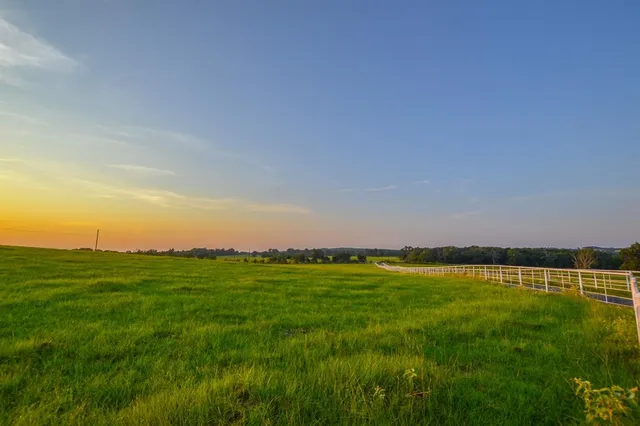 a view of swimming pool with seating space